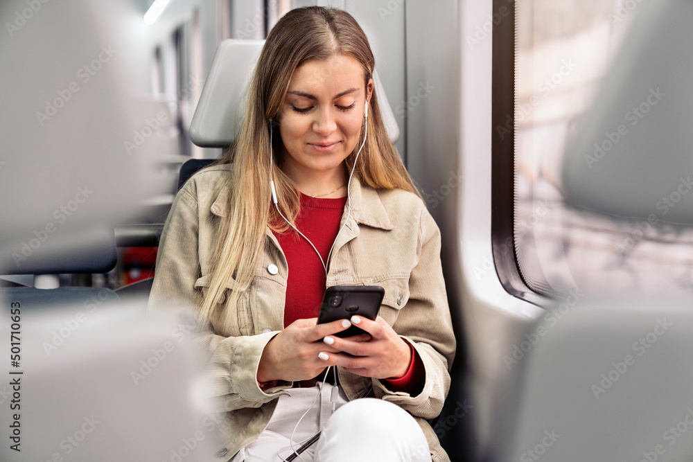 Blonde Girl in Train with Mobile Phone Blonde Girl in Train with Mobile Phone