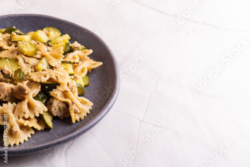 Pasta with tuna fish and zucchini. A typical italian dish ideal fot a qick lunch. photo