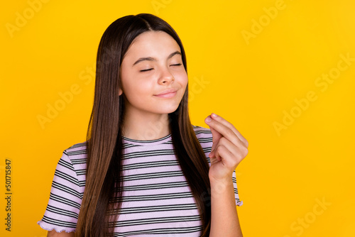 Fotografie Photo of young adorable girl show fingers delicious dessert dreamy isolated over