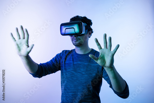 Young man with vr glasses touching illusions