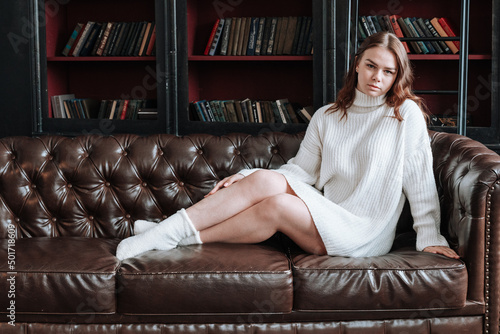 woman sitting on a sofa at home