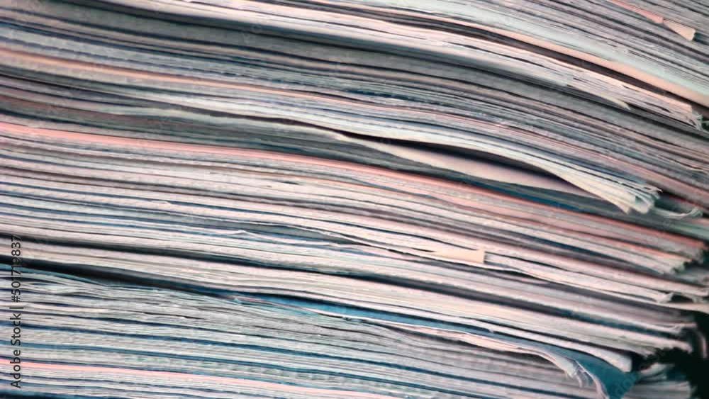 Close up of files, papers, newspapers in a stack on the desk. Close up of files, papers, newspapers in a stack on the desk.