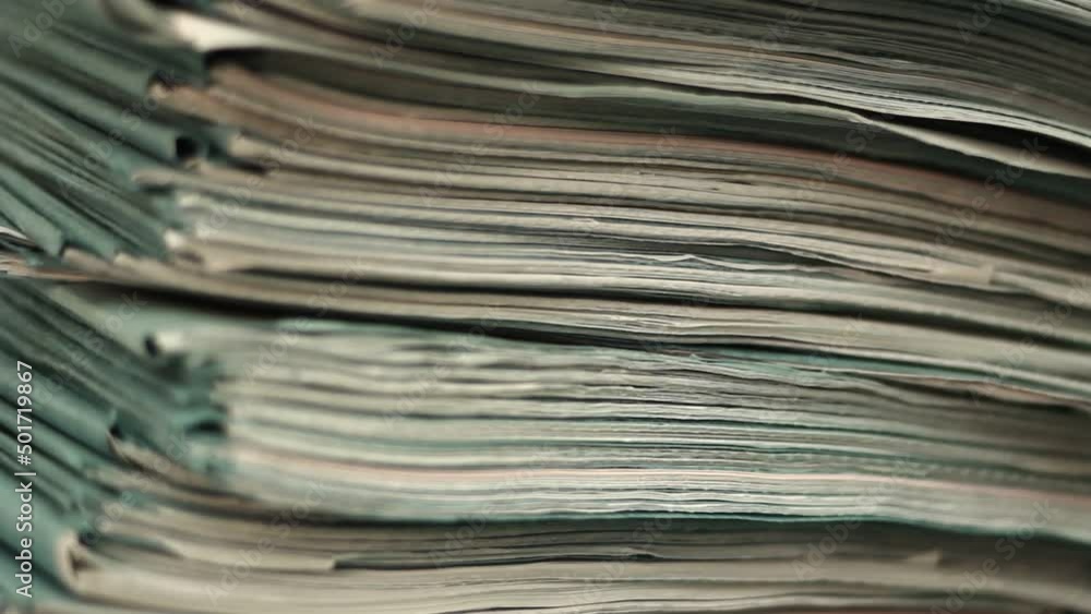 Close up of files, papers, newspapers in a stack on the desk. Close up of files, papers, newspapers in a stack on the desk.