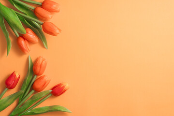 Mother's day background concept. Top view design of holiday greeting tulip flower bouquet on bright yellow table