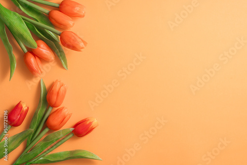 Mother's day background concept. Top view design of holiday greeting tulip flower bouquet on bright yellow table