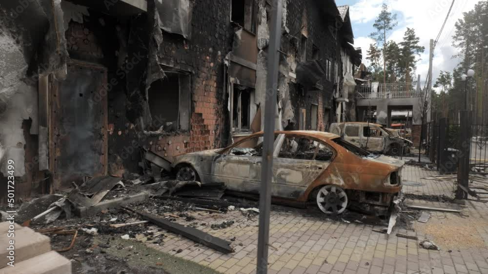 Burnt houses and cars as a result of artillery or rocket fire by the Russian army in the Kiev region Burnt houses and cars as a result of artillery or rocket fire by the Russian army in the Kiev region