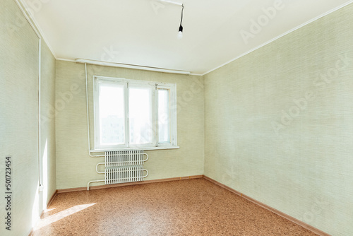 bright empty room with a window in the apartment