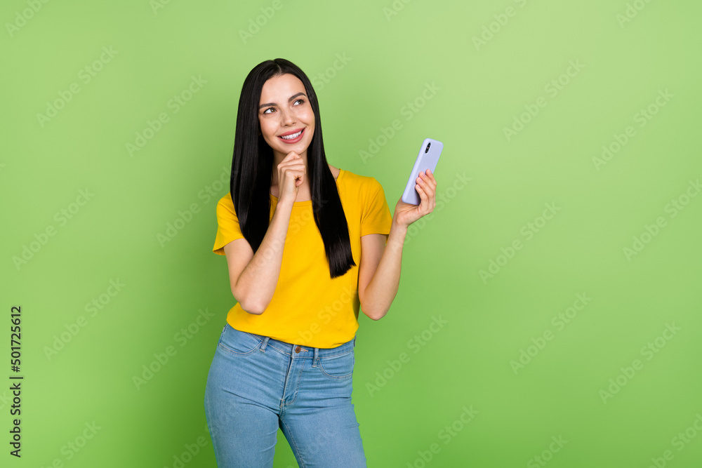 Portrait of cheerful minded lady hand chin look interested empty space imagine isolated on green color background Portrait of cheerful minded lady hand chin look interested empty space imagine isolated on green color background