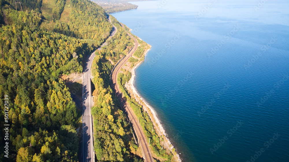 Beautiful landscape from the air. Road and railway along the lake.