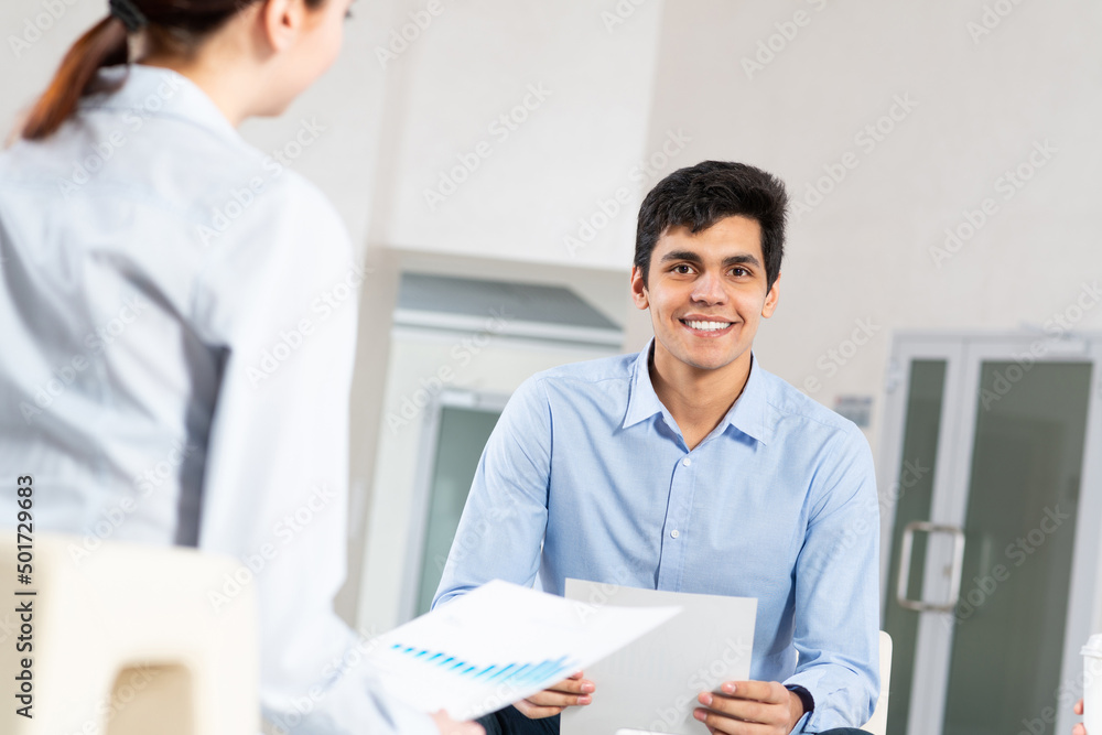 portrait of a young man at a business meeting portrait of a young man at a business meeting