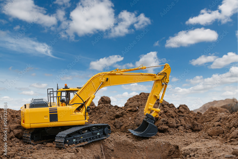 Excavator  are digging  soil in the construction site on sky   background
