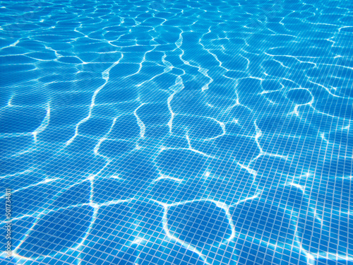 Wallpaper Mural Swimming pool bottom under the water. Sunlight reflection of transparent clear water surface. Selective focus, copy space. Texture, background Torontodigital.ca