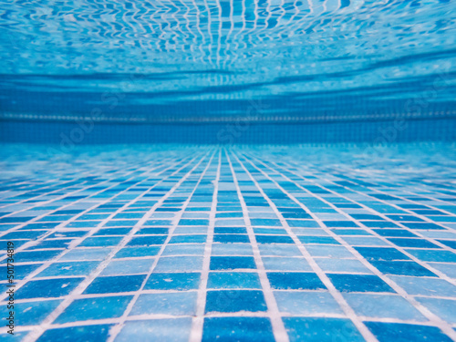 Wallpaper Mural Swimming pool bottom under the water. Reflection at transparent clear water surface. Selective focus, copy space. Texture, background Torontodigital.ca