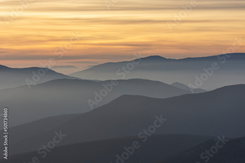 Stunning sunset over foggy Old mountain, Bulgaria. Landscape, travel concept. © RaDa