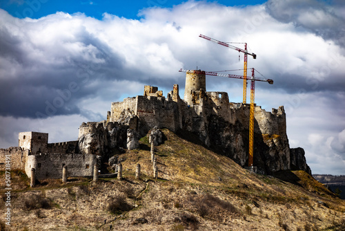 Reconstruction work on the Spi   castle with high cranes