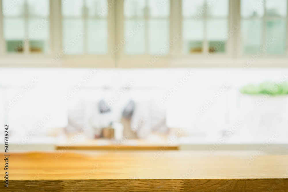Wood table with blur kitchen room background .For montage product display or design key visual layout. Wood table with blur kitchen room background .For montage product display or design key visual layout.