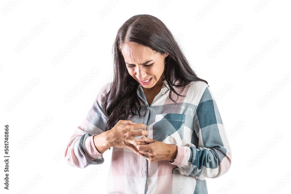 A young woman suffering from rheumatism holds her fingers due to severe joint pain. A young woman suffering from rheumatism holds her fingers due to severe joint pain.
