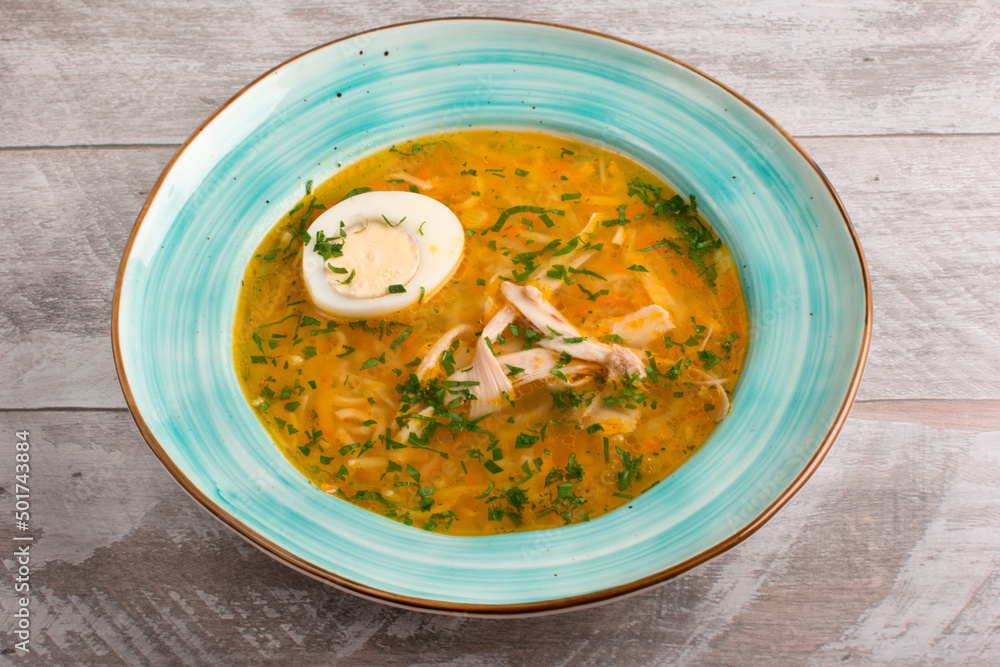 Soup soup on chicken broth with vegetables. Half an egg Soup soup on chicken broth with vegetables. Half an egg