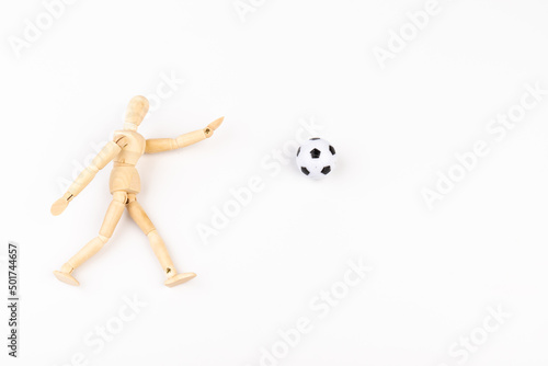 Wooden mannequin with soccer ball isolated on white background. Football player concept.