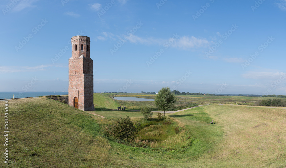 The tower Plompe Toren near the dutch village Burg-Haamstede on the Province Zeeland The Netherlands on a clear summer day