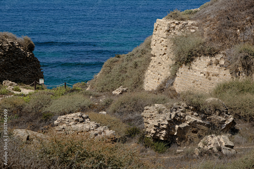 Remains of crusader's bridge over the moat of Apollonia castle,    located on a high kurkar sandstone cliff facing the Mediterranean seashore of Herzliya city, Apollonia National Park, Israel.