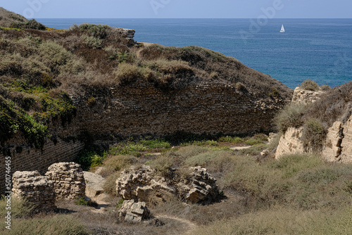 Remains of crusader's bridge over the moat of Apollonia castle,    located on a high kurkar sandstone cliff facing the Mediterranean seashore of Herzliya city, Apollonia National Park, Israel. photo