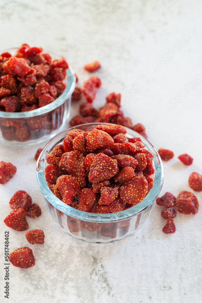 dried strawberry in glass bowl on white table background. dried strawberry in glass bowl on white table background.