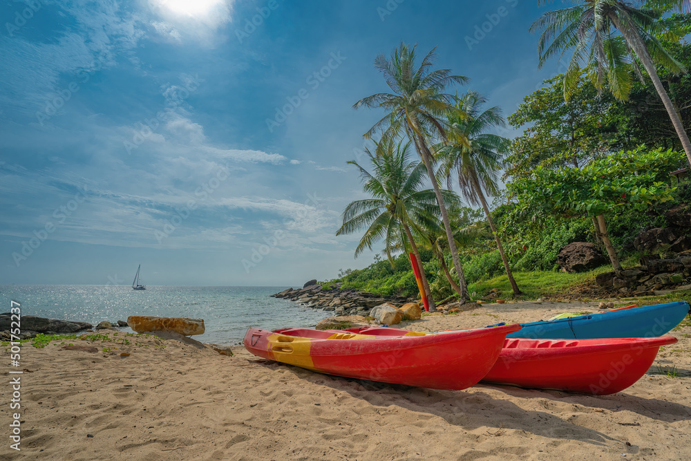 kayak on a white sand beach and beautiful sea background.
