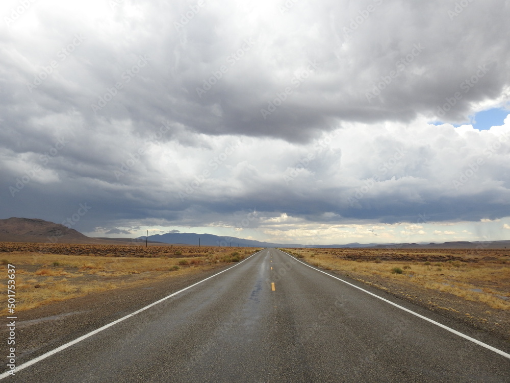 Storm clouds looming over the remote desert, above State Highway 266.  A desolate route of vast wilderness that takes you across the Nevada - California Border. 