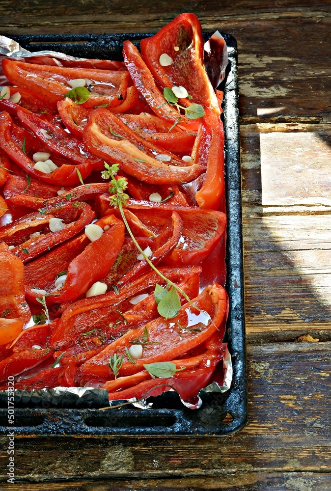 Fresh red bell pepper (paprika) sliced and ready to roast (dried) with