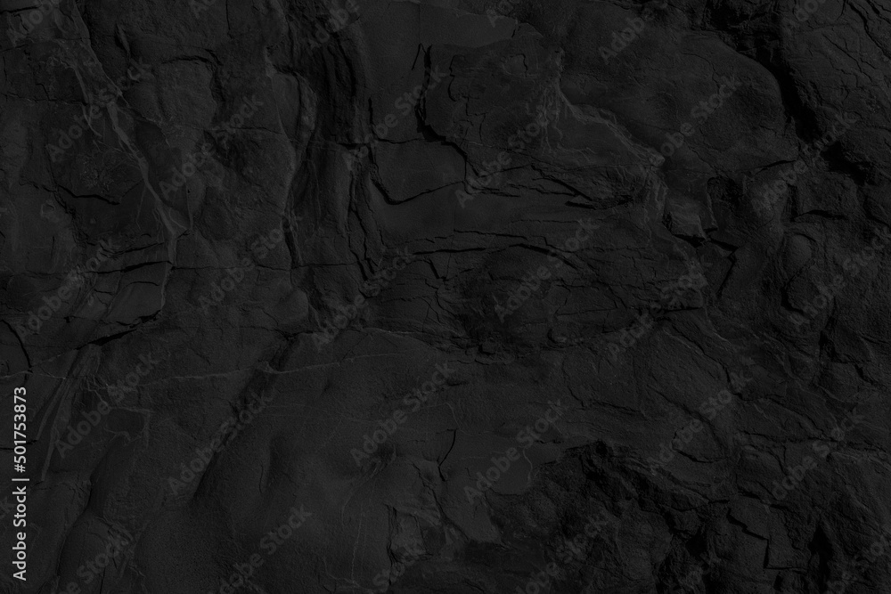 Black stone texture. Charcoal rock wall background