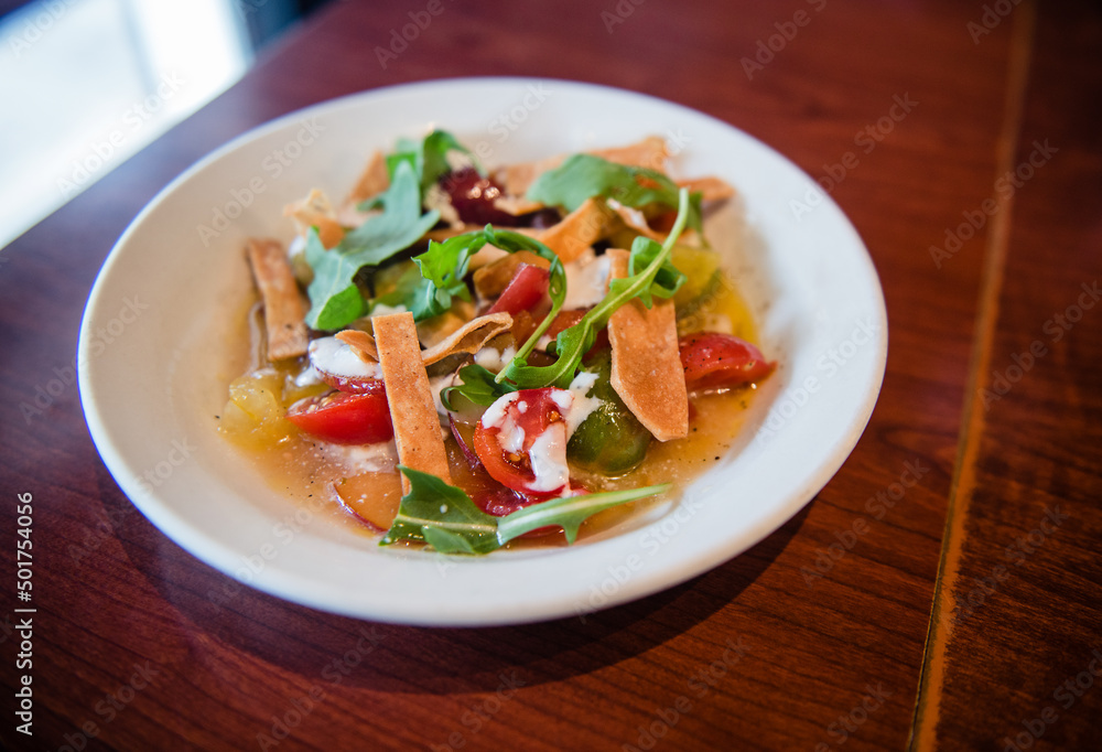 Tomato salad with fruit and crackers. Tomato salad with fruit and crackers.