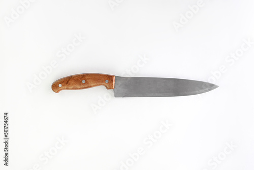 Kitchen chef knive for meat laying on white background, flat lay, view from above, space for a text