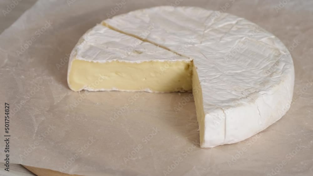 Video „Camembert cream cheese closeup rotating. Head of goat milk