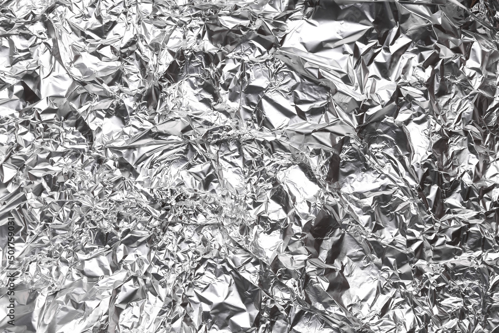Background of crumpled metal foil closeup