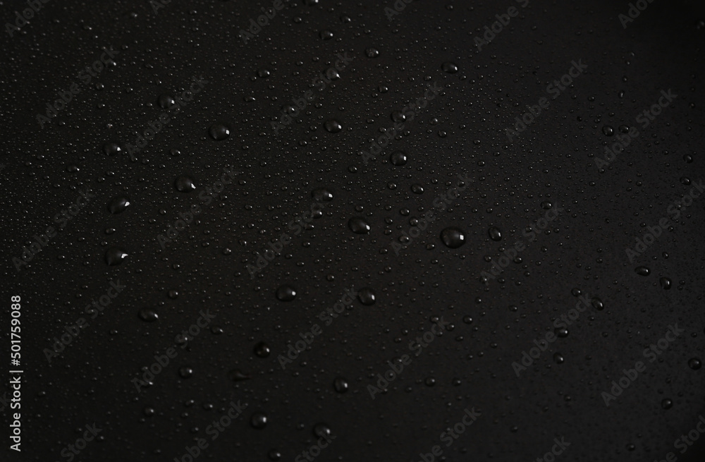 Black background with water drops. Dark background for design