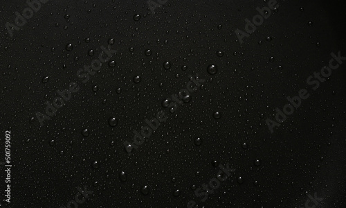 Black background with water drops. Dark background for design