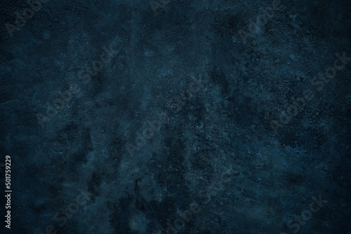 Blue green grunge background. Toned stone wall surface. Close-up. Dark background with space for design.