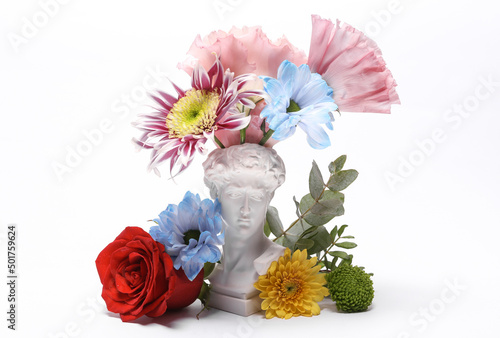 David bust with different colors isolated on white background. Aesthetic still life. Narcissism