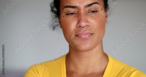 Worried young black woman. Close-up depressed girl face thinking