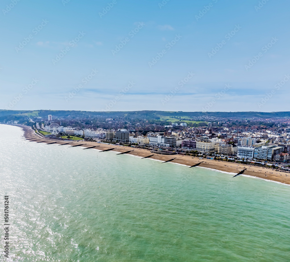 Obraz premium An aerial panorama view west along the seafront at Eastbourne, UK in springtime