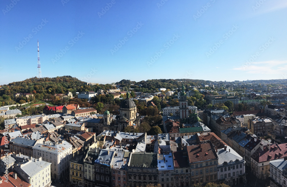 Lviv/Ukraine - Oct 13 2019. View from the top of Lviv city hall. Panoramic picture of old european town from flight height. Colorful buildings on sunny day. Medieval architectural ensemble.