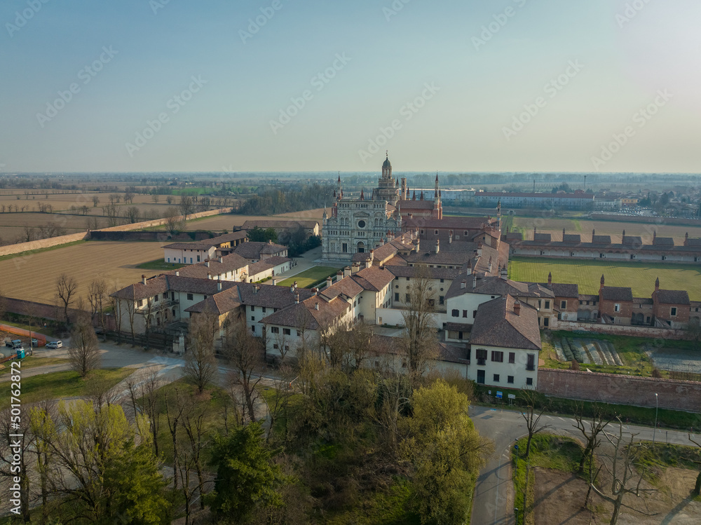 Aerial view of the Certosa di Pavia at morning, built in the late fourteenth century, courts and the cloister of the monastery and shrine in the province of Pavia, Lombardia, Italy
