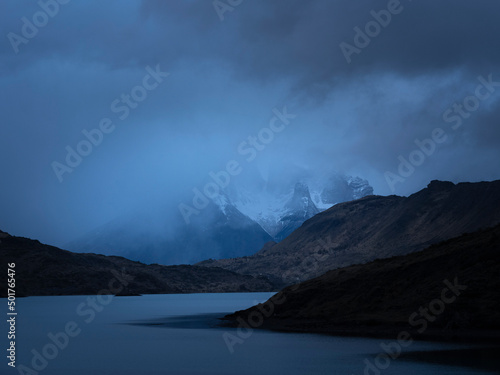 Landscape of Cuernos del Paine and a lake on a stormy day.