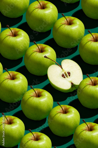 Pattern of green apples on a solid green background