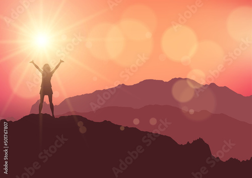 Silhouette of a female stood on top of a mountain against a sunset sky