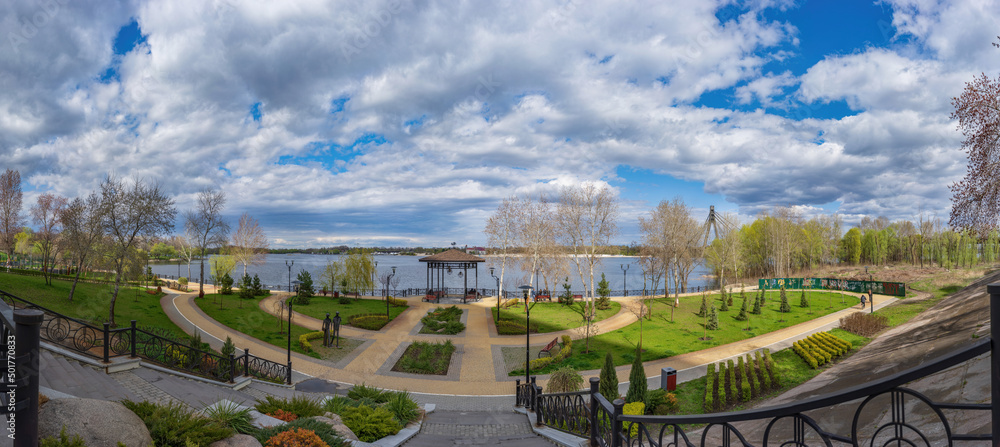 View of the modern Natalka park and the embankment of the Obolon district with beautiful clouds in the background in Kyiv.