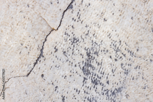 Cracked antique marble texture. Weather-cracked stone wall. Marble stone texture