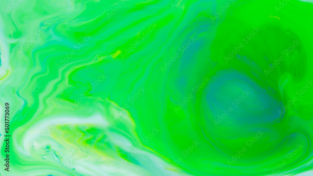 Fluid art background in green color. Green-turquoise stains on liquid. Creative background with blurred paints. Background for an eco-friendly concept Fluid art background in green color. Green-turquoise stains on liquid. Creative background with blurred paints. Background for an eco-friendly concept