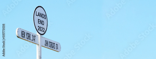 Horizontal banner or header with signpost at Land`s End Cornwall UK. Land's End to John o' Groats is the traversal of the whole length of Great Britain between two extremities - southwest & northeast photo